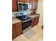Stainless steel appliances and granite countertops highlight this kitchen at 11776 Angler'S Club Dr, Placida, FL 33946
