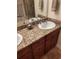 Double vanity bathroom with granite countertop at 11776 Angler'S Club Dr, Placida, FL 33946