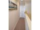Bright hallway with neutral colored walls and carpet at 11776 Angler'S Club Dr, Placida, FL 33946