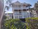 Two-story house with white columns and a spacious balcony at 11776 Angler'S Club Dr, Placida, FL 33946