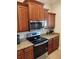 Kitchen features stainless steel appliances and wood cabinets at 11776 Angler'S Club Dr, Placida, FL 33946