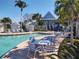 Relaxing pool area with tables and chairs at 11776 Angler'S Club Dr, Placida, FL 33946