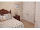 Guest bedroom with a queen-size bed, nightstand, and double doors to a large closet at 11776 Angler'S Club Dr, Placida, FL 33946