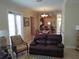 Living room with comfortable seating and a view into the dining area and kitchen at 11776 Angler'S Club Dr, Placida, FL 33946