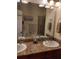 Double vanity bathroom with granite countertops and a walk-in shower at 11776 Angler'S Club Dr, Placida, FL 33946