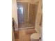 Large bathroom with a toilet, shower, and tiled flooring at 11776 Angler'S Club Dr, Placida, FL 33946