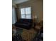 Living area featuring a reclining sofa and a charming accent chair at 11776 Angler'S Club Dr, Placida, FL 33946