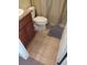 Bathroom featuring a tiled floor and brown vanity at 11776 Angler'S Club Dr, Placida, FL 33946