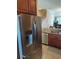 Modern kitchen with stainless steel refrigerator and granite countertops at 11776 Angler'S Club Dr, Placida, FL 33946