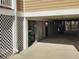 Covered parking area under the house with access to storage at 11776 Angler'S Club Dr, Placida, FL 33946