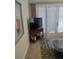 Living room with a TV stand and access to the outside at 11776 Angler'S Club Dr, Placida, FL 33946