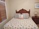 Comfortable bedroom with double bed and wood nightstand at 11776 Angler'S Club Dr, Placida, FL 33946
