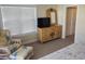 Bedroom with comfy chair, dresser, and TV at 11776 Angler'S Club Dr, Placida, FL 33946