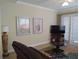 Living room features a comfortable couch and access to patio at 11776 Angler'S Club Dr, Placida, FL 33946