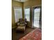 Bedroom with sitting area and private balcony access at 11776 Angler'S Club Dr, Placida, FL 33946