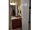 Bathroom with granite countertop, wood cabinets and a shower/tub combo at 11776 Angler'S Club Dr, Placida, FL 33946