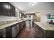 Modern kitchen featuring stainless steel appliances and granite countertops at 15 Tulane Rd, Venice, FL 34293