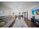 Open living room with dark wood floors and a view of the kitchen at 15 Tulane Rd, Venice, FL 34293