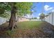 Spacious backyard with mature tree and fenced perimeter at 15 Tulane Rd, Venice, FL 34293