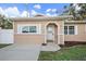 Inviting front entrance featuring a white door and trim, and a newly landscaped garden bed at 15 Tulane Rd, Venice, FL 34293