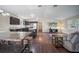 Kitchen with dark cabinets, granite counters, and a farmhouse table at 15 Tulane Rd, Venice, FL 34293