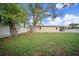Fenced backyard offering a large grassy area at 15 Tulane Rd, Venice, FL 34293