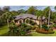 Aerial view of home showcasing lush landscaping and a private setting at 2005 Tocobaga Ln, Nokomis, FL 34275