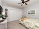 This bedroom features a large window, closet, and a queen-size bed at 2005 Tocobaga Ln, Nokomis, FL 34275