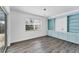 Bright dining room with built-in shelving and light teal cabinets at 2420 Sunnyside St, Sarasota, FL 34239