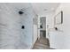 Modern bathroom with marble-look shower and sleek vanity at 2420 Sunnyside St, Sarasota, FL 34239