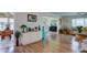 Spacious living room with wood floors and views into dining area at 2609 Riverbluff Pkwy # 146, Sarasota, FL 34231