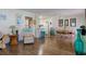 Open concept dining area with wood floors and kitchen view at 2609 Riverbluff Pkwy # 146, Sarasota, FL 34231