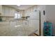 Kitchen boasts granite countertops and ample cabinetry at 2609 Riverbluff Pkwy # 146, Sarasota, FL 34231