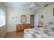 Comfortable bedroom, complete with dresser and ceiling fan at 2609 Riverbluff Pkwy # 146, Sarasota, FL 34231