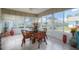 Sunroom with glass windows, seating area, and view of backyard at 2609 Riverbluff Pkwy # 146, Sarasota, FL 34231