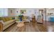 Comfortable living room featuring a large sectional sofa and wood floors at 2609 Riverbluff Pkwy # 146, Sarasota, FL 34231
