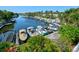 Waterfront community with boat slips and lush tropical landscaping at 2609 Riverbluff Pkwy # 146, Sarasota, FL 34231
