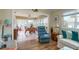 Cozy living area with wood floors and view into sunroom at 2609 Riverbluff Pkwy # 146, Sarasota, FL 34231