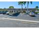 Building exterior with parking lot and landscaping at 2609 Riverbluff Pkwy # 146, Sarasota, FL 34231