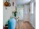 Bright and airy entryway with wood-look floors, leading to other rooms at 2609 Riverbluff Pkwy # 146, Sarasota, FL 34231