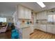 Updated kitchen with granite counters and white cabinets at 2609 Riverbluff Pkwy # 146, Sarasota, FL 34231