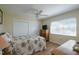 Well-lit bedroom with double closet and wood flooring at 2609 Riverbluff Pkwy # 146, Sarasota, FL 34231
