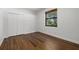 Bright bedroom with hardwood floors and double-door closet at 3801 Eagle Hammock Dr, Sarasota, FL 34240