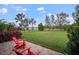 Lush backyard with mature trees, landscaping and seating at 409 147Th Ne Ct, Bradenton, FL 34212