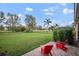 Spacious backyard with lush lawn, patio, and black metal fencing at 409 147Th Ne Ct, Bradenton, FL 34212