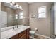 Bright bathroom with double vanity, marble countertop and walk-in shower at 409 147Th Ne Ct, Bradenton, FL 34212