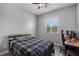 Bedroom with window and ceiling fan, features bed and desk area at 409 147Th Ne Ct, Bradenton, FL 34212