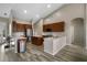 Modern kitchen featuring stainless steel appliances, granite counters, and wood-look tile flooring at 409 147Th Ne Ct, Bradenton, FL 34212
