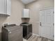 Laundry room with new washer and dryer, plus ample storage at 409 147Th Ne Ct, Bradenton, FL 34212