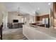 Open floor plan with kitchen view, spacious living area with ceiling fan, and abundant natural light at 409 147Th Ne Ct, Bradenton, FL 34212